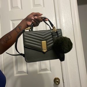 Olive green quilted Aldo crossbody handbag.